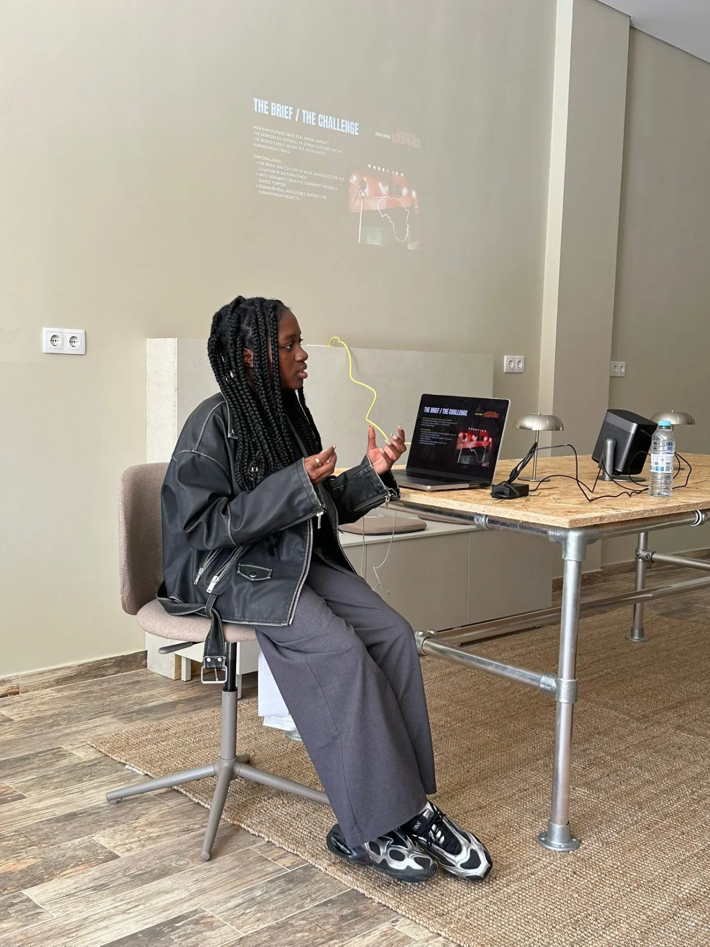 A speaker presenting a creative brief at Out Of Office